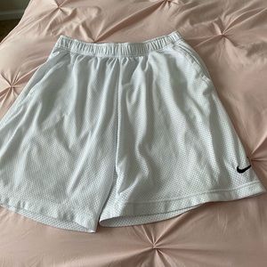 Men’s white Nike dry fit workout shorts.